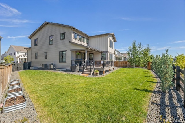 9016 Moondance Dr, Littleton, CO 80125 - back of property featuring a fenced backyard and a wooden deck