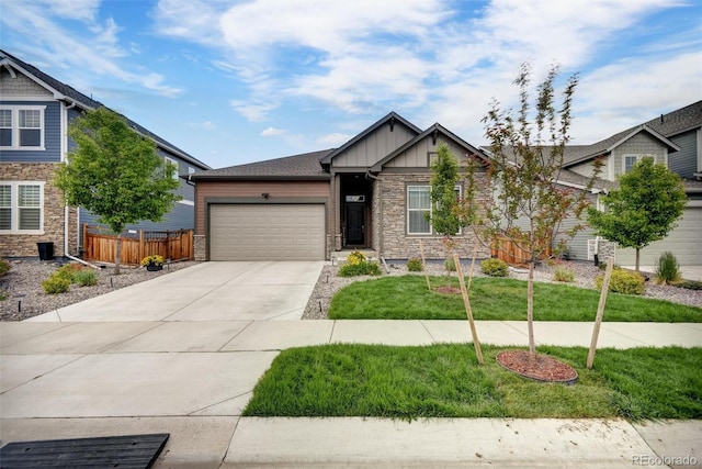 5771 Slate River Pl, Brighton, CO 80601 - craftsman house with board and batten siding, stone siding, an attached garage, and driveway