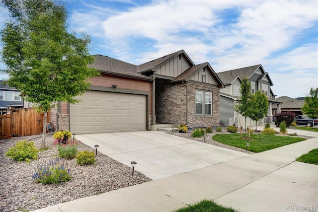 5771 Slate River Pl, Brighton, CO 80601 - craftsman-style home with board and batten siding, stone siding, a garage, and concrete driveway