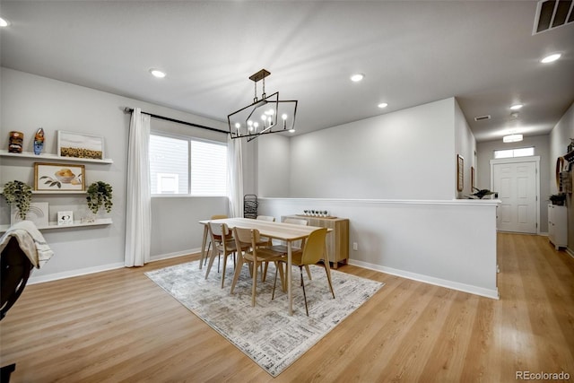 5771 Slate River Pl, Brighton, CO 80601 - dining space with a chandelier, plenty of natural light, light wood-type flooring, baseboards, and recessed lighting