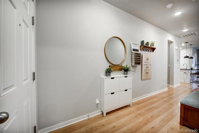 5771 Slate River Pl, Brighton, CO 80601 - hallway featuring light wood finished floors, baseboards, and recessed lighting