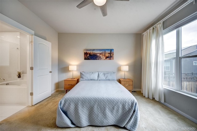 5771 Slate River Pl, Brighton, CO 80601 - bedroom with carpet floors, connected bathroom, ceiling fan, and baseboards