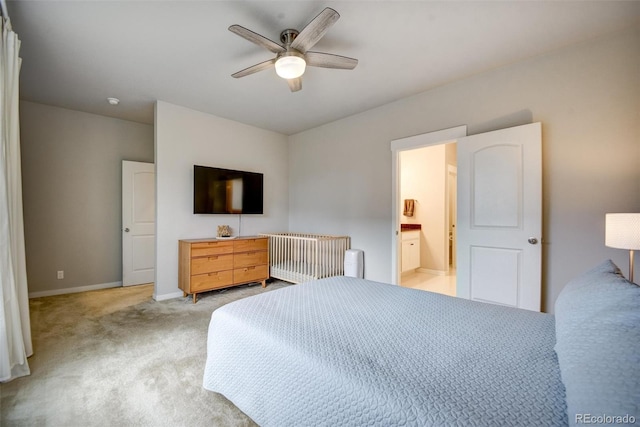 5771 Slate River Pl, Brighton, CO 80601 - bedroom featuring light carpet, baseboards, a ceiling fan, and connected bathroom