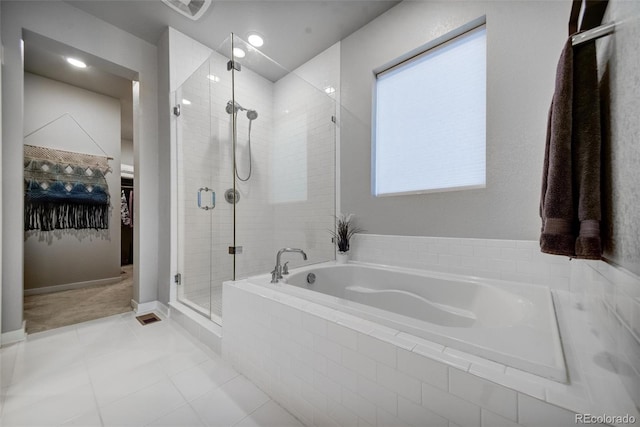 5771 Slate River Pl, Brighton, CO 80601 - bathroom with a stall shower, a garden tub, a walk in closet, tile patterned floors, and recessed lighting