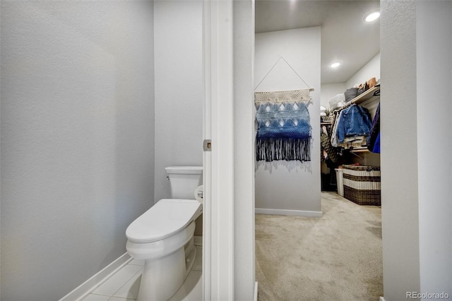5771 Slate River Pl, Brighton, CO 80601 - bathroom featuring toilet, a walk in closet, and baseboards