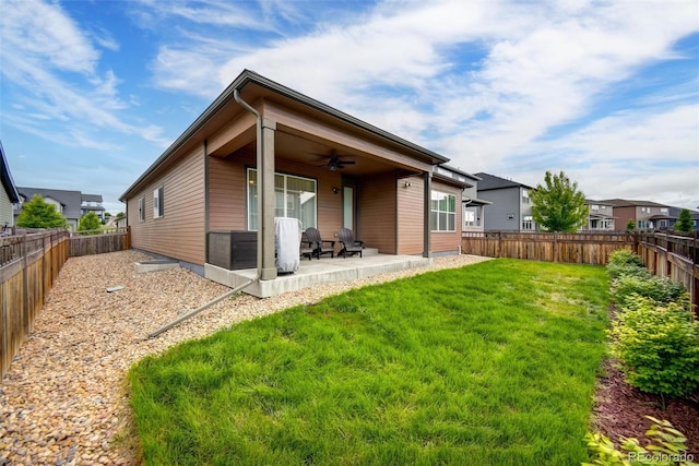 5771 Slate River Pl, Brighton, CO 80601 - back of property with a ceiling fan and a patio area