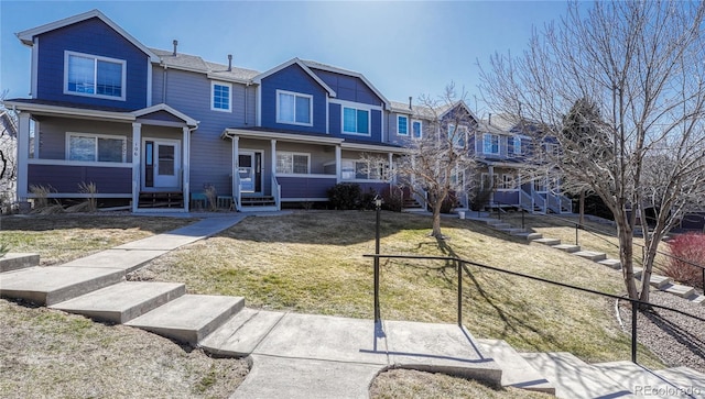 view of front of home featuring a residential view and a front lawn