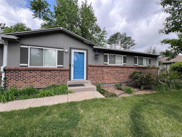 18908 E Napa Dr, Aurora, CO 80013 - single story home featuring brick siding, a front lawn, and entry steps