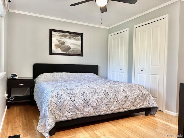 18908 E Napa Dr, Aurora, CO 80013 - bedroom with two closets, hardwood / wood-style floors, crown molding, and a ceiling fan