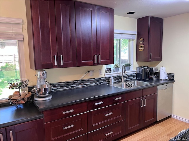 18908 E Napa Dr, Aurora, CO 80013 - kitchen featuring dishwasher, dark countertops, light wood-style flooring, and dark brown cabinets