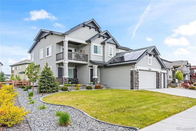 10091 Hannaway Dr, Colorado Springs, CO 80924 - view of front of property featuring stucco siding, stone siding, solar panels, and a balcony