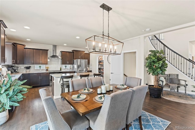 10091 Hannaway Dr, Colorado Springs, CO 80924 - dining area featuring stairs, dark wood-style flooring, recessed lighting, and a chandelier