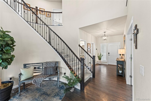 10091 Hannaway Dr, Colorado Springs, CO 80924 - foyer featuring baseboards, stairway, wood finished floors, a chandelier, and plenty of natural light
