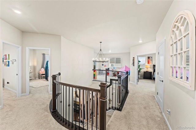 10091 Hannaway Dr, Colorado Springs, CO 80924 - corridor with an upstairs landing, light carpet, a chandelier, baseboards, and recessed lighting