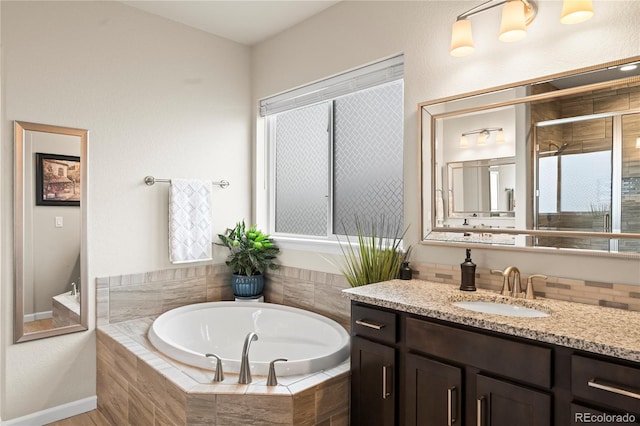 10091 Hannaway Dr, Colorado Springs, CO 80924 - bathroom featuring a bath, a shower stall, and vanity