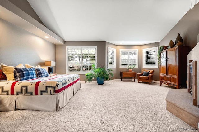 bedroom with lofted ceiling, recessed lighting, and carpet floors