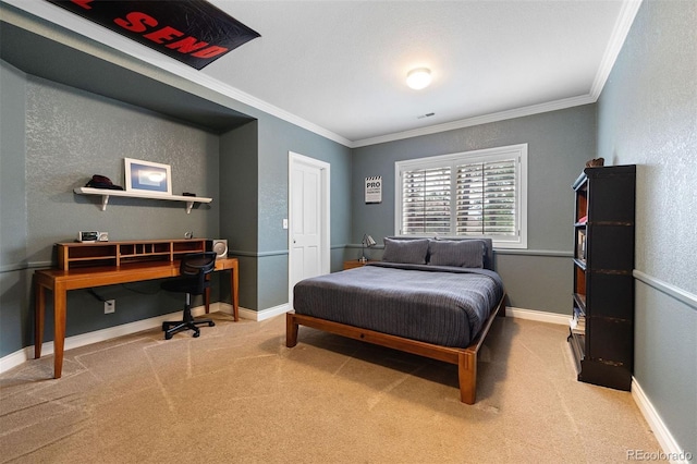 bedroom with carpet flooring, a textured wall, baseboards, and ornamental molding