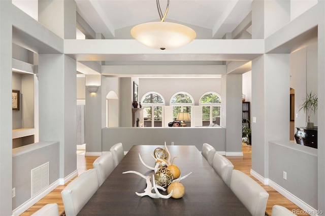 dining room with visible vents, baseboards, and wood finished floors