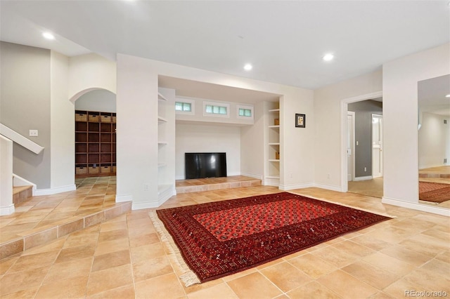 tiled living area with stairway, recessed lighting, built in shelves, and baseboards