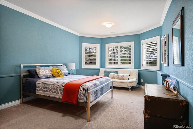 carpeted bedroom with crown molding, a textured wall, and baseboards