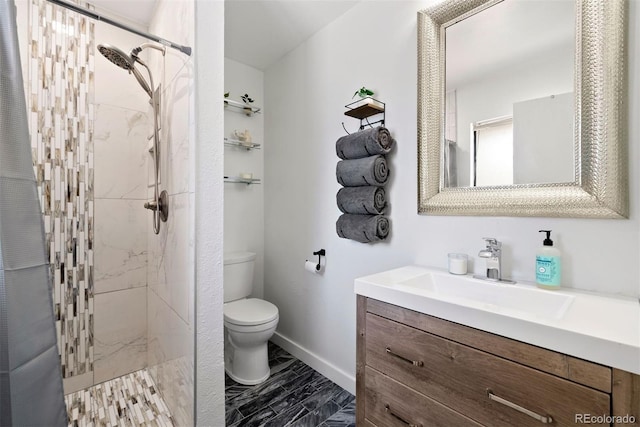 bathroom featuring a marble finish shower, baseboards, vanity, and toilet