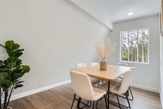 dining space with recessed lighting, light wood-type flooring, and baseboards