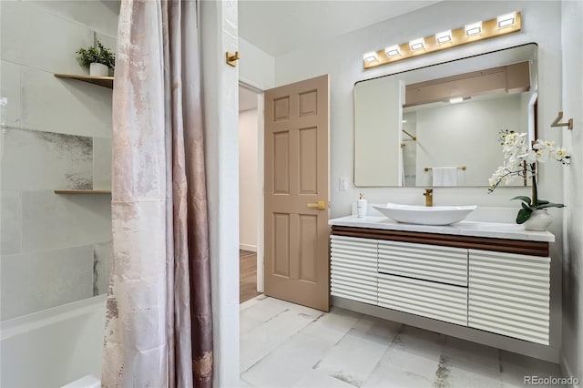 bathroom with shower / bath combo with shower curtain and vanity