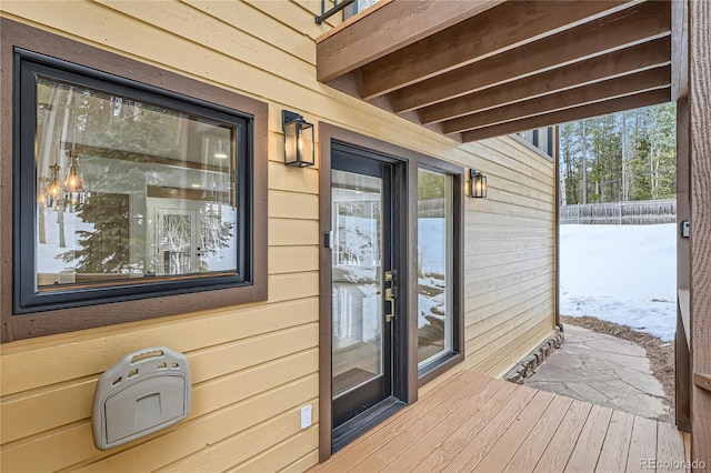 view of snow covered property entrance