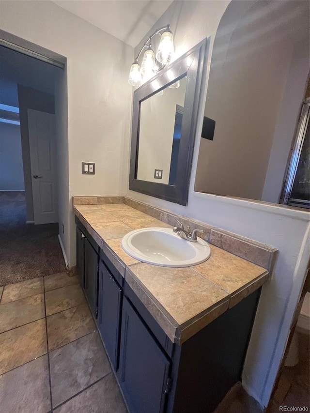 bathroom featuring vanity and tile flooring