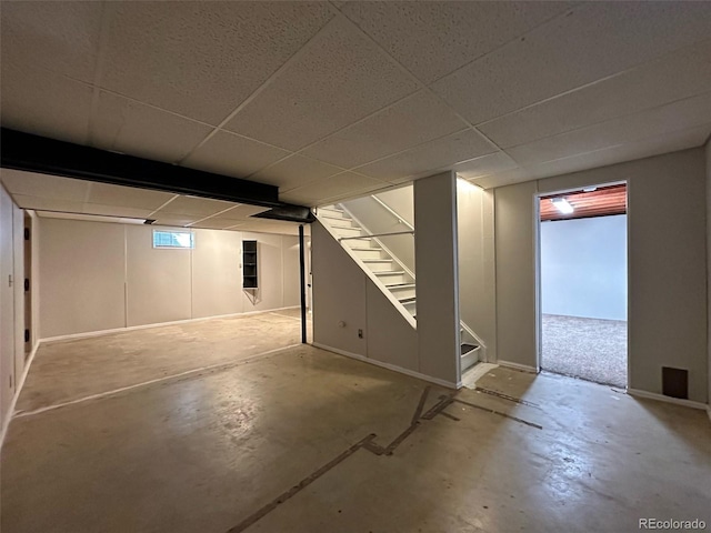 basement featuring a paneled ceiling