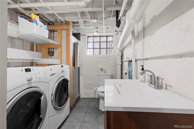 831 Manitou Blvd, Colorado Springs, CO 80904 - laundry area with laundry area, a sink, light tile patterned floors, and washer and clothes dryer