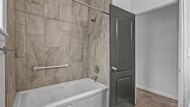 2891 Streamside Ave, Grand Junction, CO 81501 - full bath with a combined bath / shower with jetted tub, wood finished floors, and baseboards