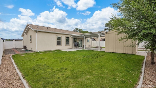 2891 Streamside Ave, Grand Junction, CO 81501 - back of property featuring a gate, a patio, cooling unit, and stucco siding