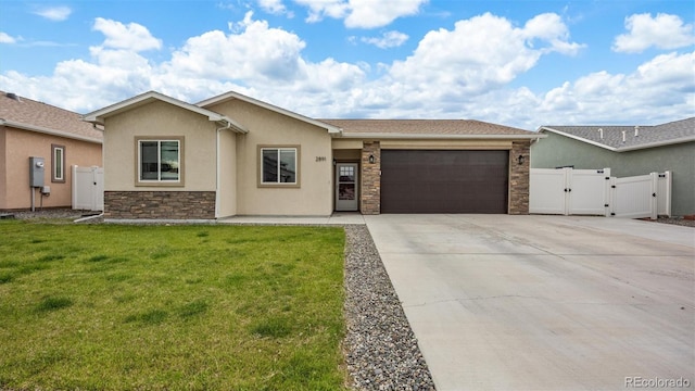 2891 Streamside Ave, Grand Junction, CO 81501 - ranch-style house featuring a gate, a garage, driveway, stone siding, and stucco siding