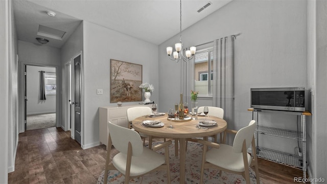 2891 Streamside Ave, Grand Junction, CO 81501 - dining room with dark wood finished floors, a chandelier, and baseboards