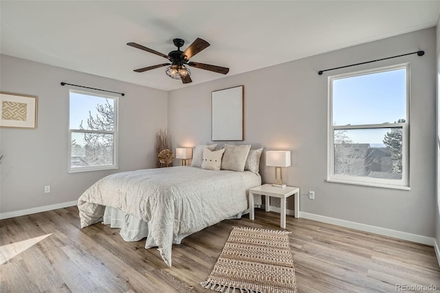 499 Wright St Unit 308, Lakewood, CO 80228 - bedroom with baseboards, ceiling fan, and wood finished floors