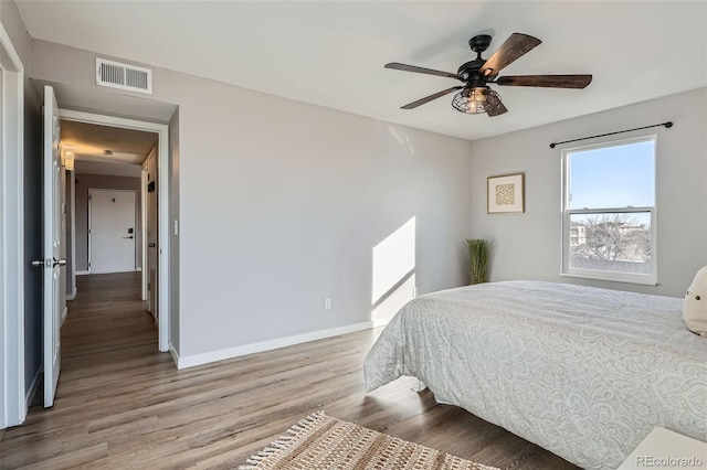 499 Wright St Unit 308, Lakewood, CO 80228 - bedroom with visible vents, baseboards, a ceiling fan, and wood finished floors