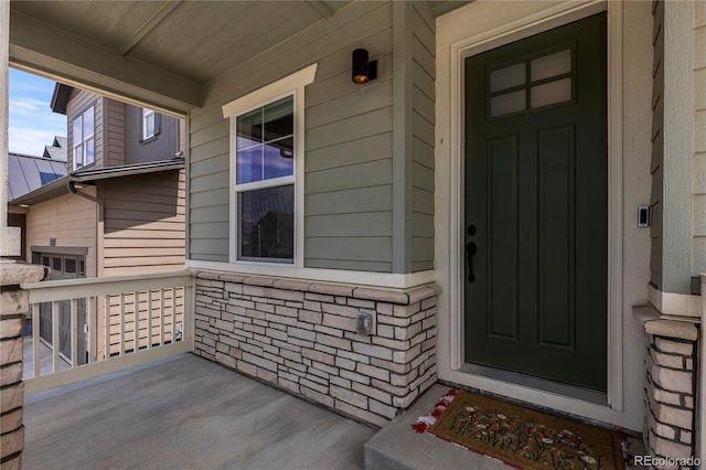 8550 Cheraw St, Littleton, CO 80125 - entrance to property featuring a porch and stone siding