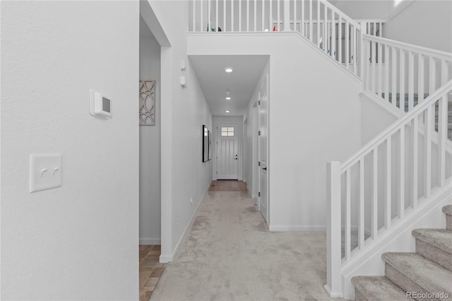8550 Cheraw St, Littleton, CO 80125 - hallway with carpet and stairs