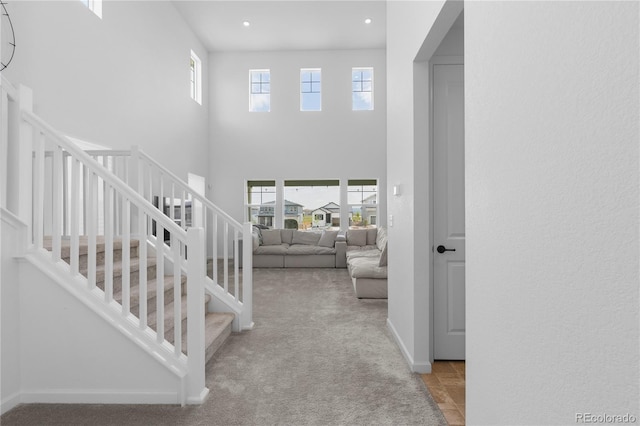 8550 Cheraw St, Littleton, CO 80125 - stairway with a high ceiling, recessed lighting, and carpet flooring