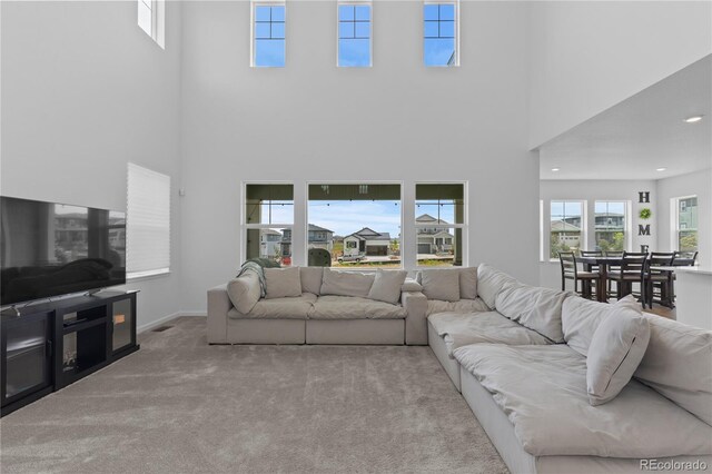8550 Cheraw St, Littleton, CO 80125 - living room featuring a towering ceiling and carpet floors