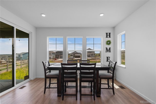 8550 Cheraw St, Littleton, CO 80125 - dining room with wood finished floors and recessed lighting
