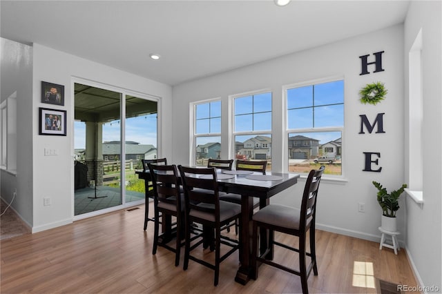 8550 Cheraw St, Littleton, CO 80125 - dining area featuring wood finished floors and recessed lighting