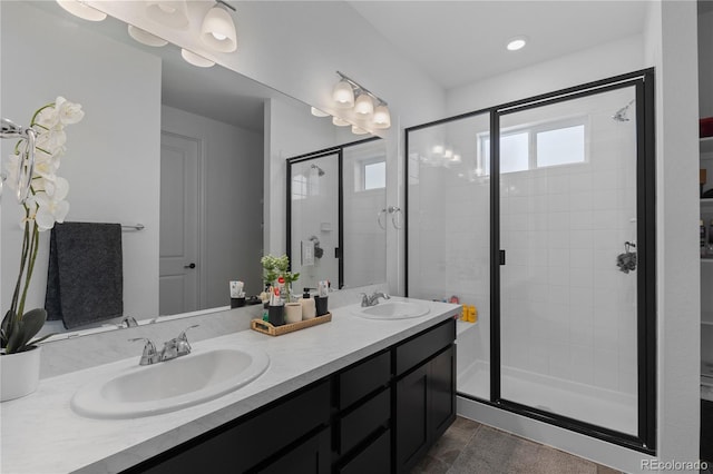 8550 Cheraw St, Littleton, CO 80125 - full bathroom featuring a stall shower and double vanity