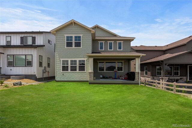 8550 Cheraw St, Littleton, CO 80125 - rear view of property with board and batten siding