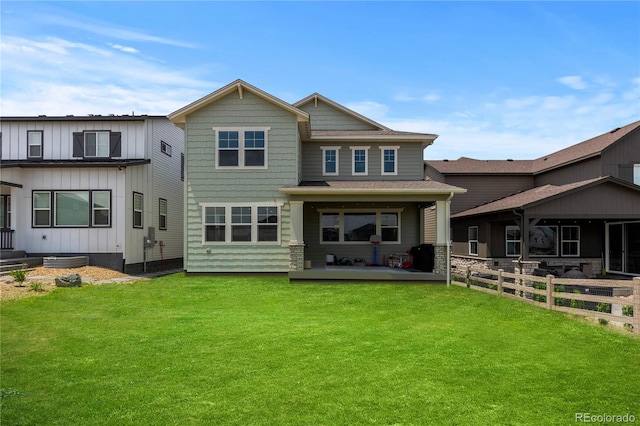 8550 Cheraw St, Littleton, CO 80125 - rear view of house with a patio area, board and batten siding, and roof with shingles
