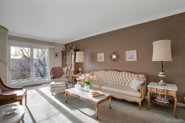 carpeted living room featuring ornamental molding