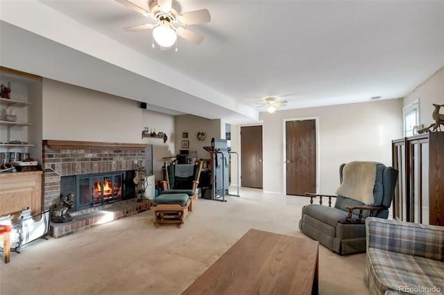 carpeted living area featuring a fireplace and ceiling fan