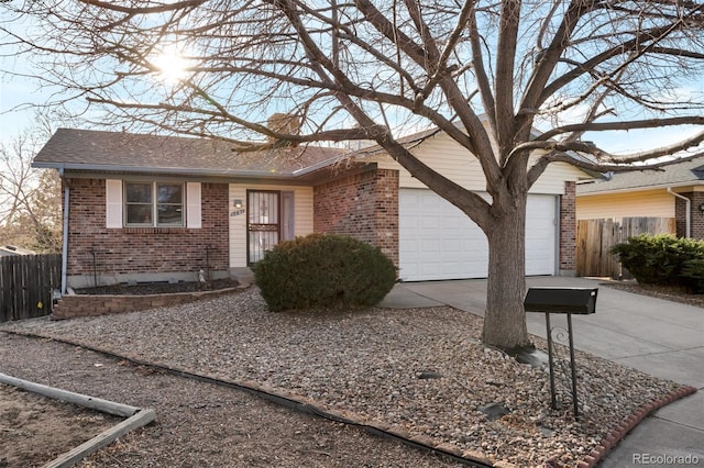 ranch-style home featuring brick siding, an attached garage, fence, roof with shingles, and driveway