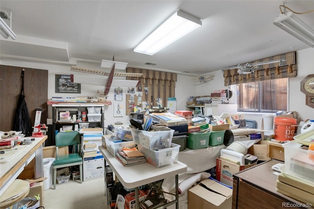 basement with visible vents and a workshop area